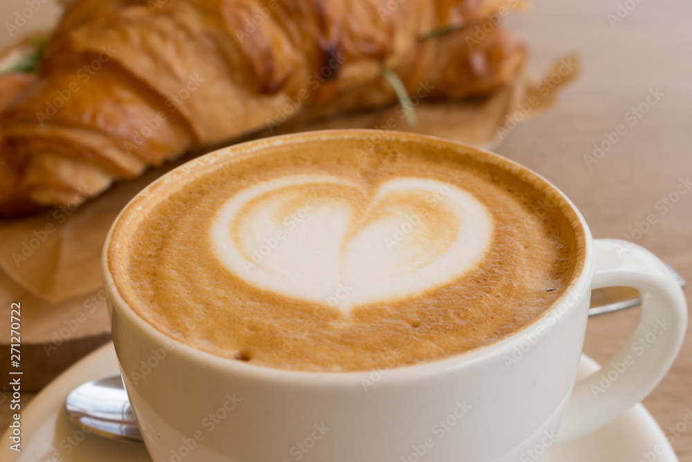 Cappuccino and croissant with a complex filling, Breakfast, lunch Cappuccino and croissant with a complex filling, Breakfast, lunch