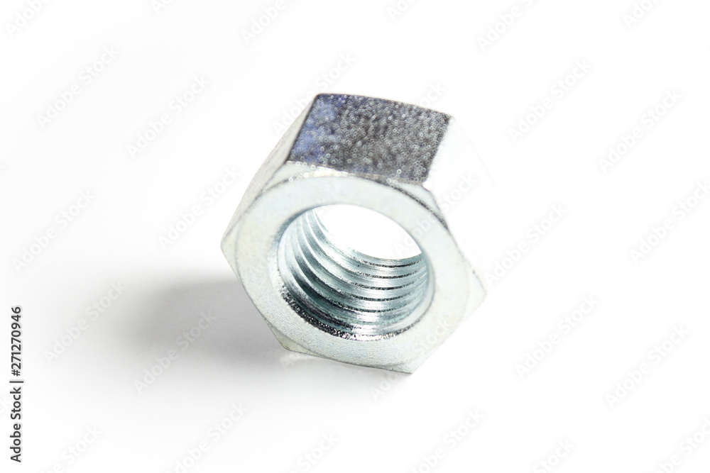 Silver metal nut on a white isolated background Silver metal nut on a white isolated background
