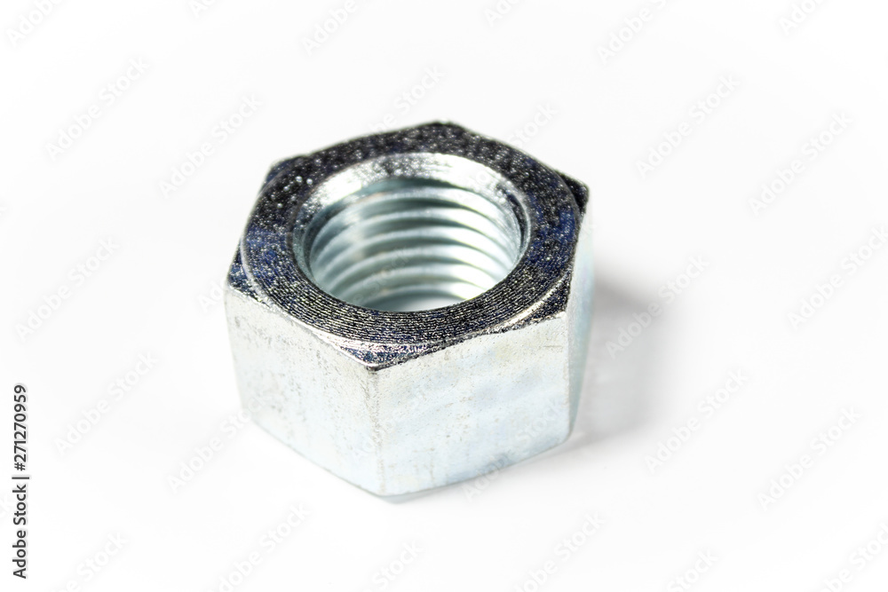 Silver metal nut on a white isolated background Silver metal nut on a white isolated background