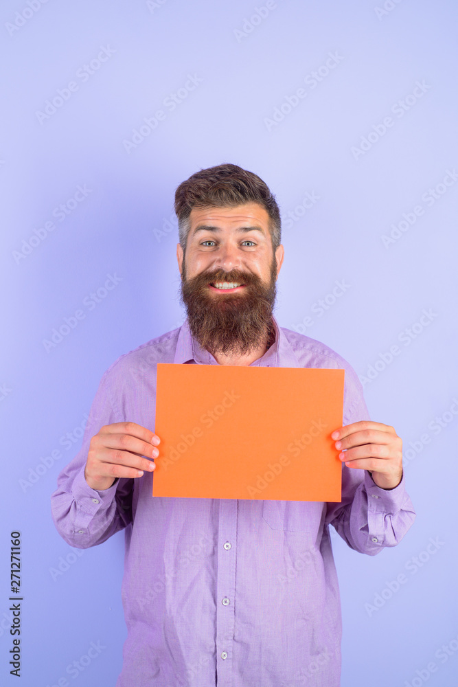 Smiling bearded man holding little advertising board. Advertising. Sale. Online shopping. Advertising banner. Seasons sale. Discount. Black friday. Add. Copy space for text. Smiling bearded man holding little advertising board. Advertising. Sale. Online shopping. Advertising banner. Seasons sale. Discount. Black friday. Add. Copy space for text.