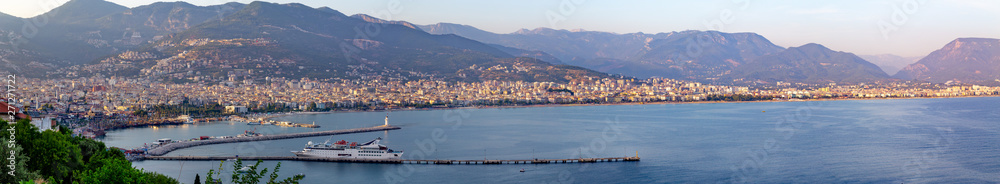 Alanya panorama at sunset with a view into the shore and modern (new) port