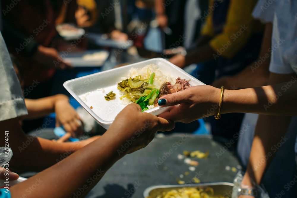 Fototapeta premium Hunger problems of the poor have been donated food to reduce hunger : the concept of food shortage in the world : Donate Food with Love and Hope to the Poor: The concept of food is essential to life
