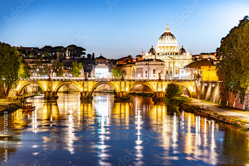 Fototapeta Naklejka Na Ścianę i Meble -  St Peters Basilica in Vatican and Ponte Sant'Angelo Bridge over Tiber River at dusk. Romantic evening cityscape of Rome, Italy