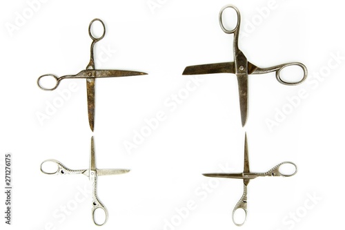 Four vintage scissors in quadrangular shape