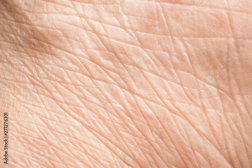 Close up old skin texture with wrinkles on body human photo