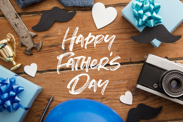 Happy Father's Day background concept with presents, mustache and trophy