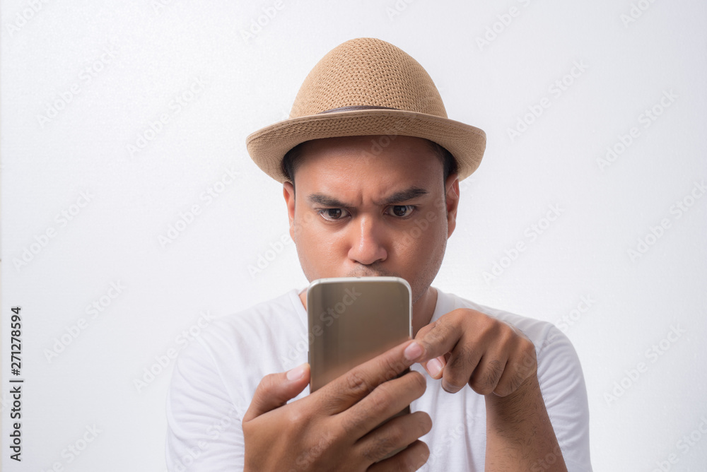 Young asian man looking smartphone. Young asian man looking smartphone.