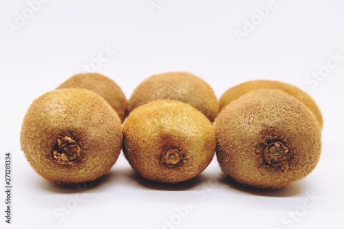 Ripe kiwi fruit on white background