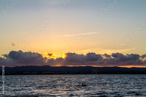Golden sunsets are the highlight on this beach, Point Chevier, Auckland, New Zealand photo