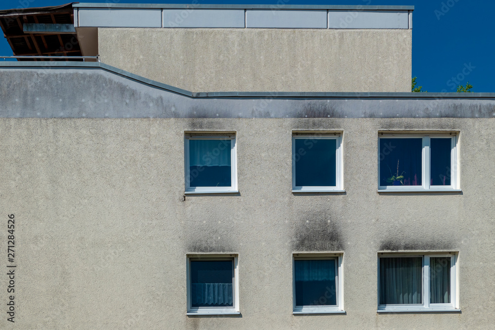 old dirty house facade with flat roof renovation needs old dirty house facade with flat roof renovation needs