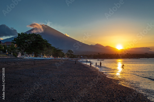 Gunung Agung from Amed Beach at sunset photo