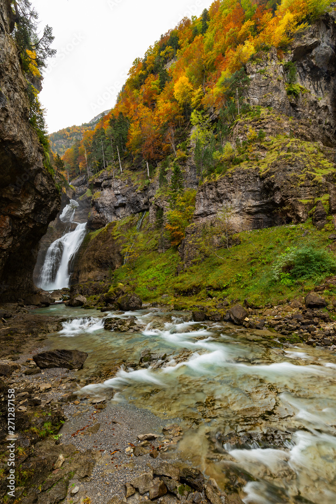 Autumn Landscape of Ordesa National Park in autumn with trees full of orange and yellow leaves Autumn Landscape of Ordesa National Park in autumn with trees full of orange and yellow leaves
