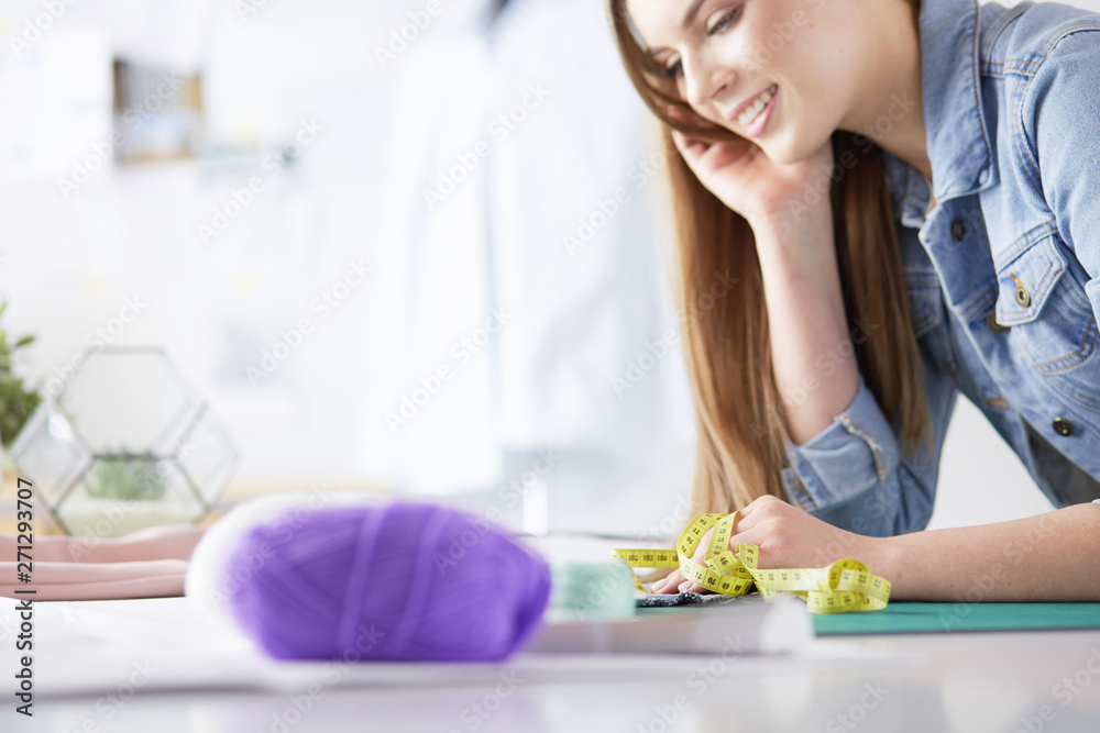 Woman American fashion designer working in atelier. Woman American fashion designer working in atelier.