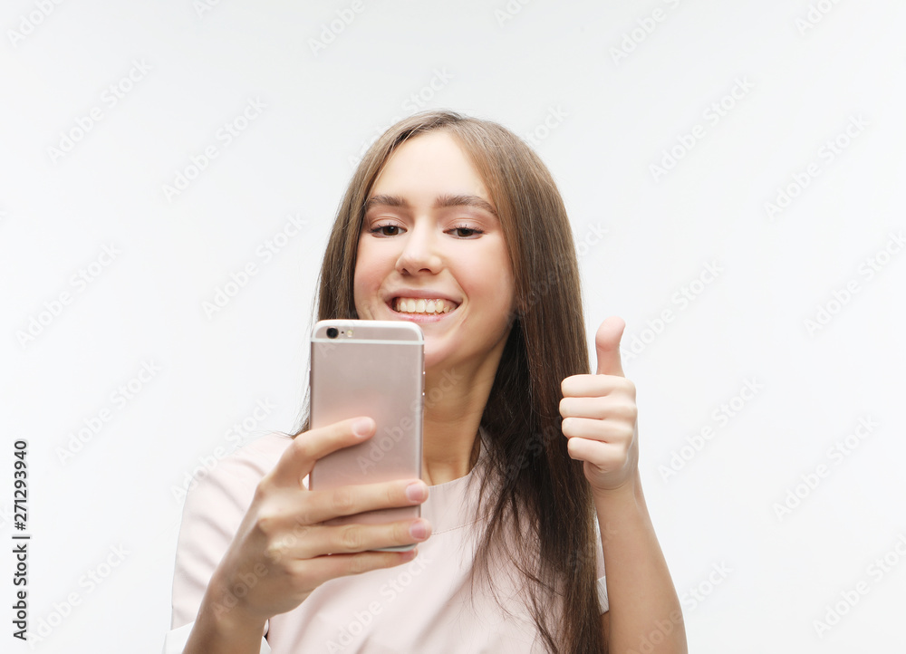 happy smiling young woman wearing taking selfie with smartphone happy smiling young woman wearing taking selfie with smartphone