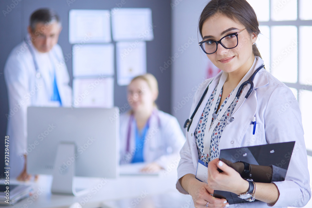 Woman doctor standing with stethoscope at hospital Woman doctor standing with stethoscope at hospital