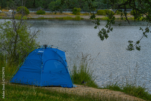 Fishing from a tent at a trout pond at Lake Camanche