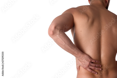 Young man with back pain. The athlete clings to a sore back. Man hurt his back. Sports medicine concept photo