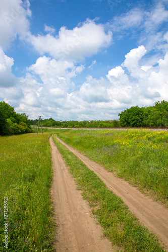 Summer landscape with railway and country road