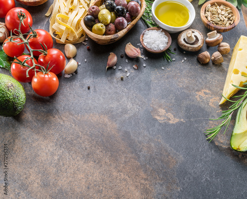 Pasta, spices and vegetables. Popular mediterranean or italian food ingredients.