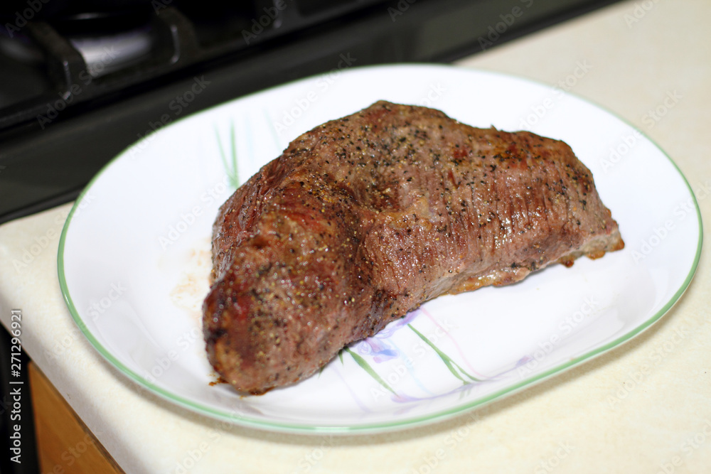 Sirloin tritip steak on a plate.