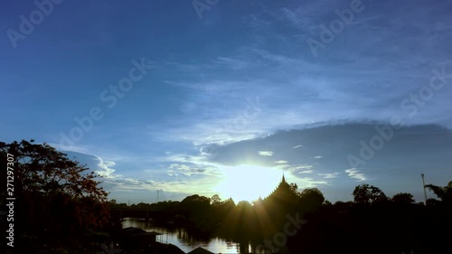 Silhouette temple the river sunset time lapse in Phitsanuloke at Thailand Asia photo