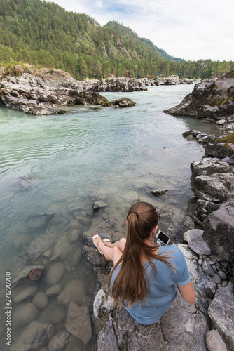 Woman resting at river in A...
