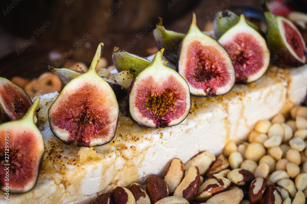 Gourmet natural food. Gourmet parma cheese with caramelized figs. Fruit of high gastronomy, for social events like weddings and parties.
