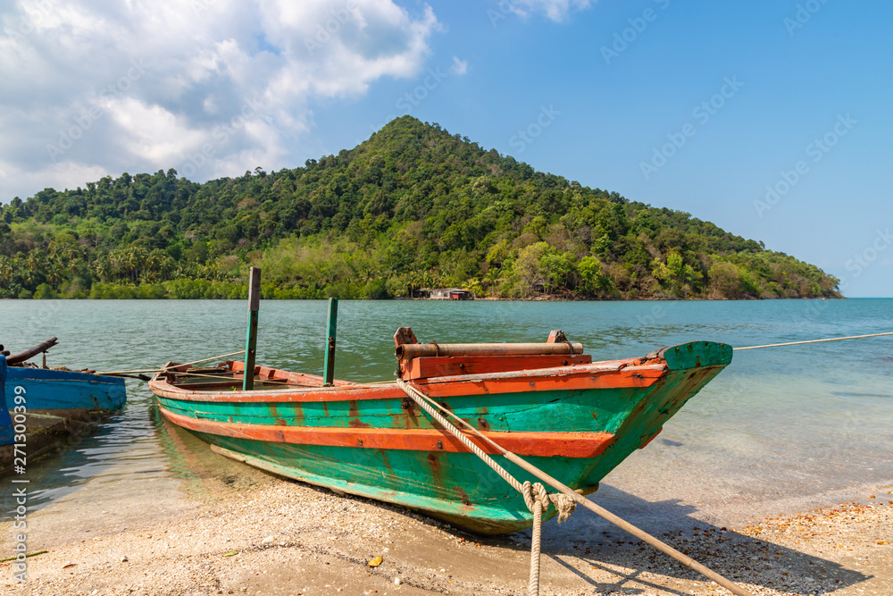 Old fishing boat on the beach of Koh Chang, Thailand