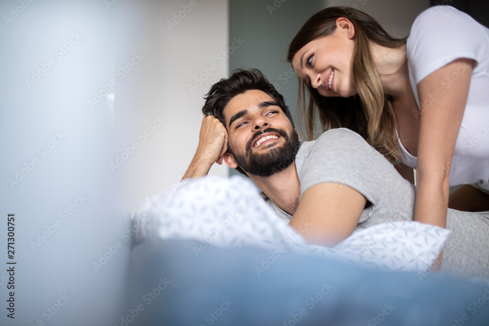 Intimate sensual young couple in bedroom enjoying each other. Intimate sensual young couple in bedroom enjoying each other.