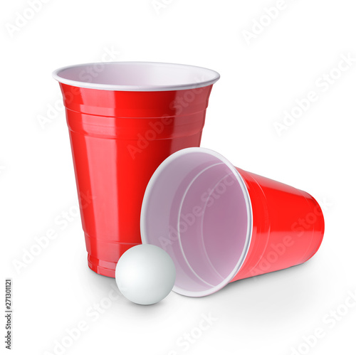 Beer pong. Red plastic cups and ping pong ball solated on white background