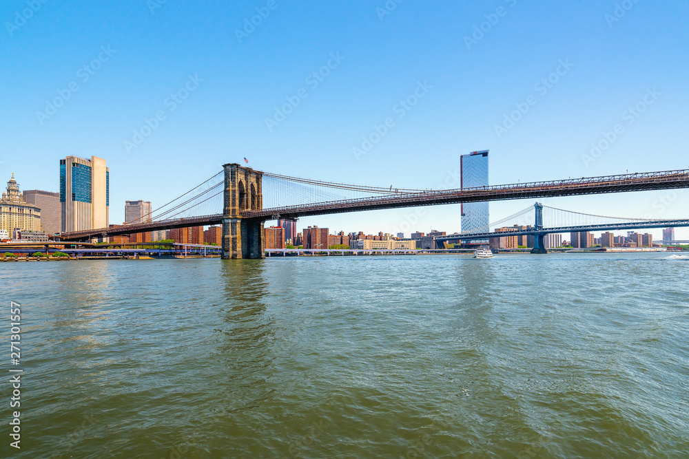 Brooklyn Bridge and Manhattan Bridge in New York City. Boat Tour Journey