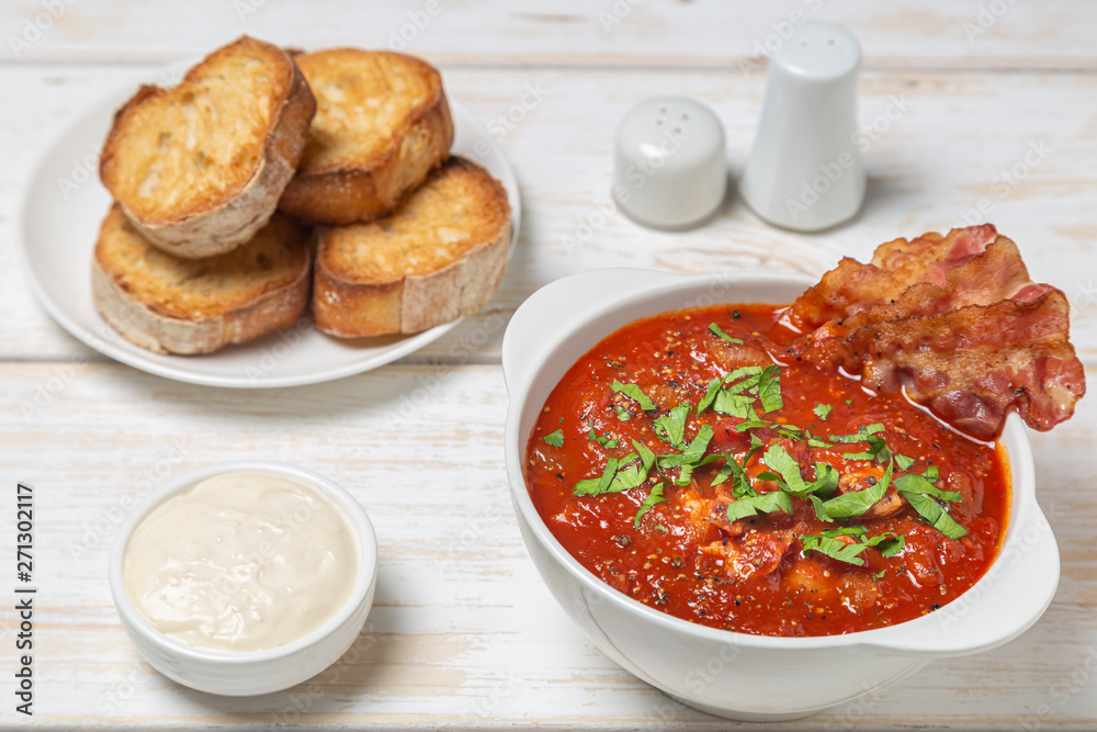 Tomato soup with bacon. European cuisine.