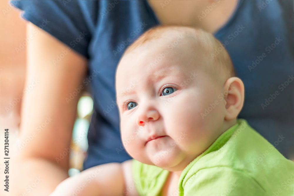 Portrait of a child close-up, little happy child in the arms of mom. Portrait of a child close-up, little happy child in the arms of mom.