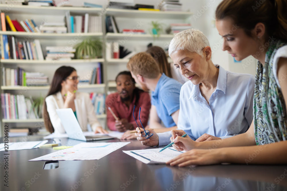Group of successful business people at work in office Group of successful business people at work in office