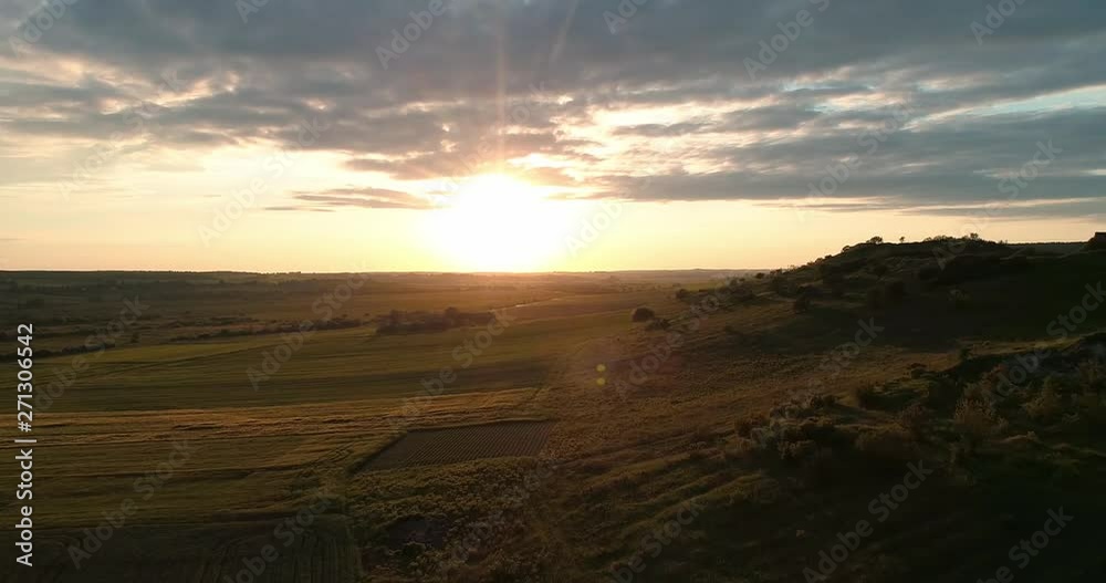 Sunset on the wheat field of the cloud. Arial