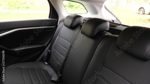 artificial leather rear seats in car. beautiful leather car interior design. luxury leather seats in the car. Black leather seat covers in the car. © zoteva87