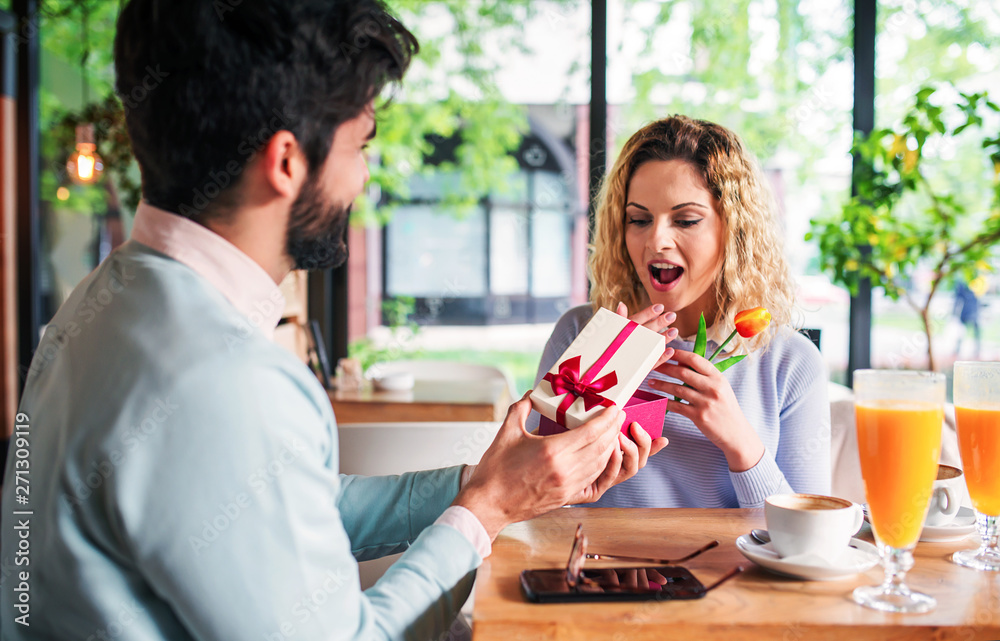 Romantic couple in the cafe. Dating, love, relationships Romantic couple in the cafe. Dating, love, relationships