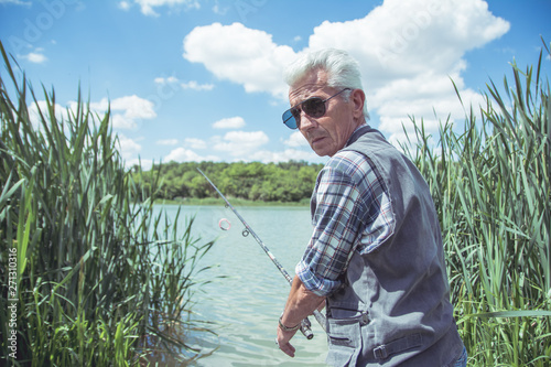 Man fishing by a lake