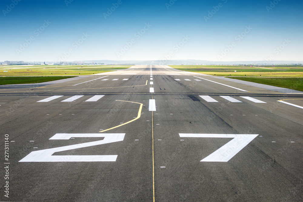 vanishing point of view from an airport track, blue sky background vanishing point of view from an airport track, blue sky background