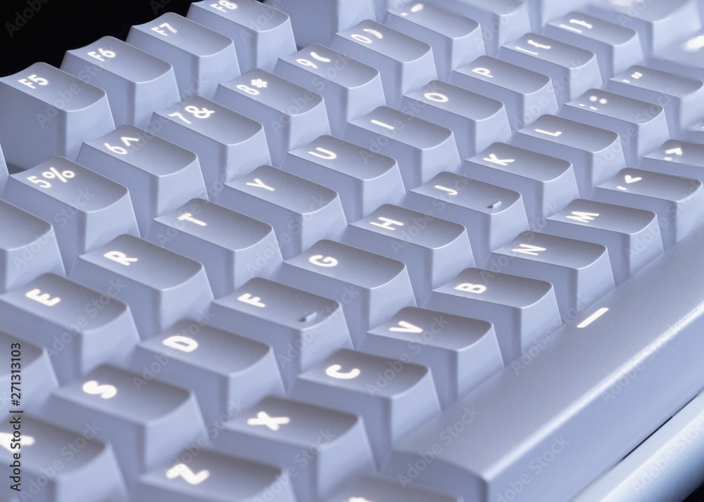 white LED glowing mechanical keyboard - close up white LED glowing mechanical keyboard - close up