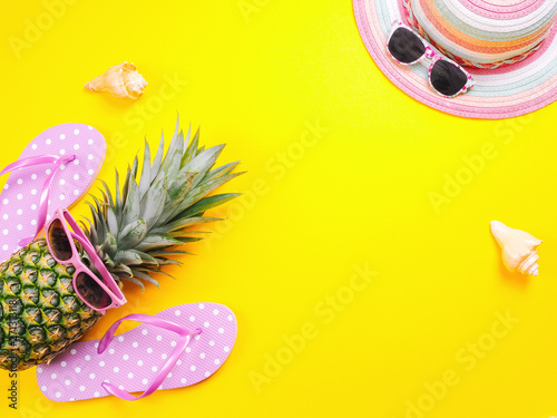 Pineapple wearing sunglasses on a yellow background