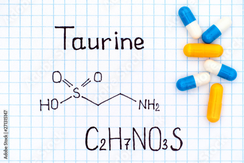 Chemical formula of Taurine with some pills.