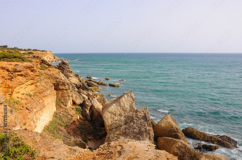 Atlantic Ocean seascape with cliffs and rocks near Conil de la Frontera in Cádiz, Spain