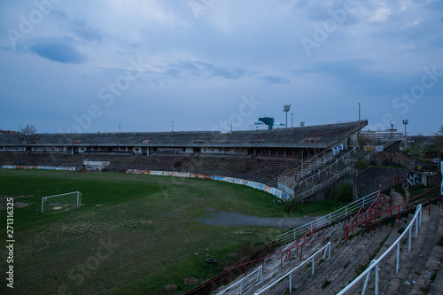Abadoned Stadion Za Luzankami is a currently inactive stadium in Brno, Czech Republic. Captured in spring sunset, sky and clouds was colored to blue dark colors. Photo from tribunes and inside middle