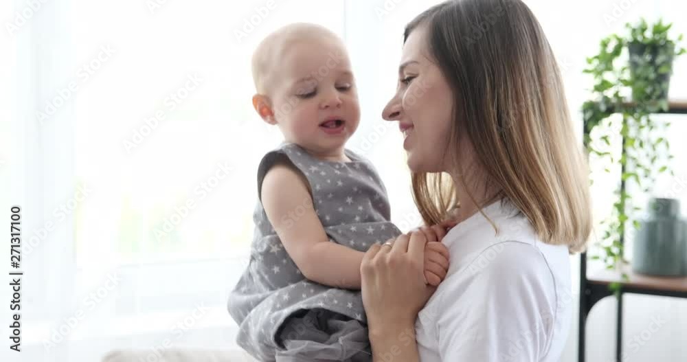 Happy mother dancing with cute baby daughter at home Happy mother dancing with cute baby daughter at home