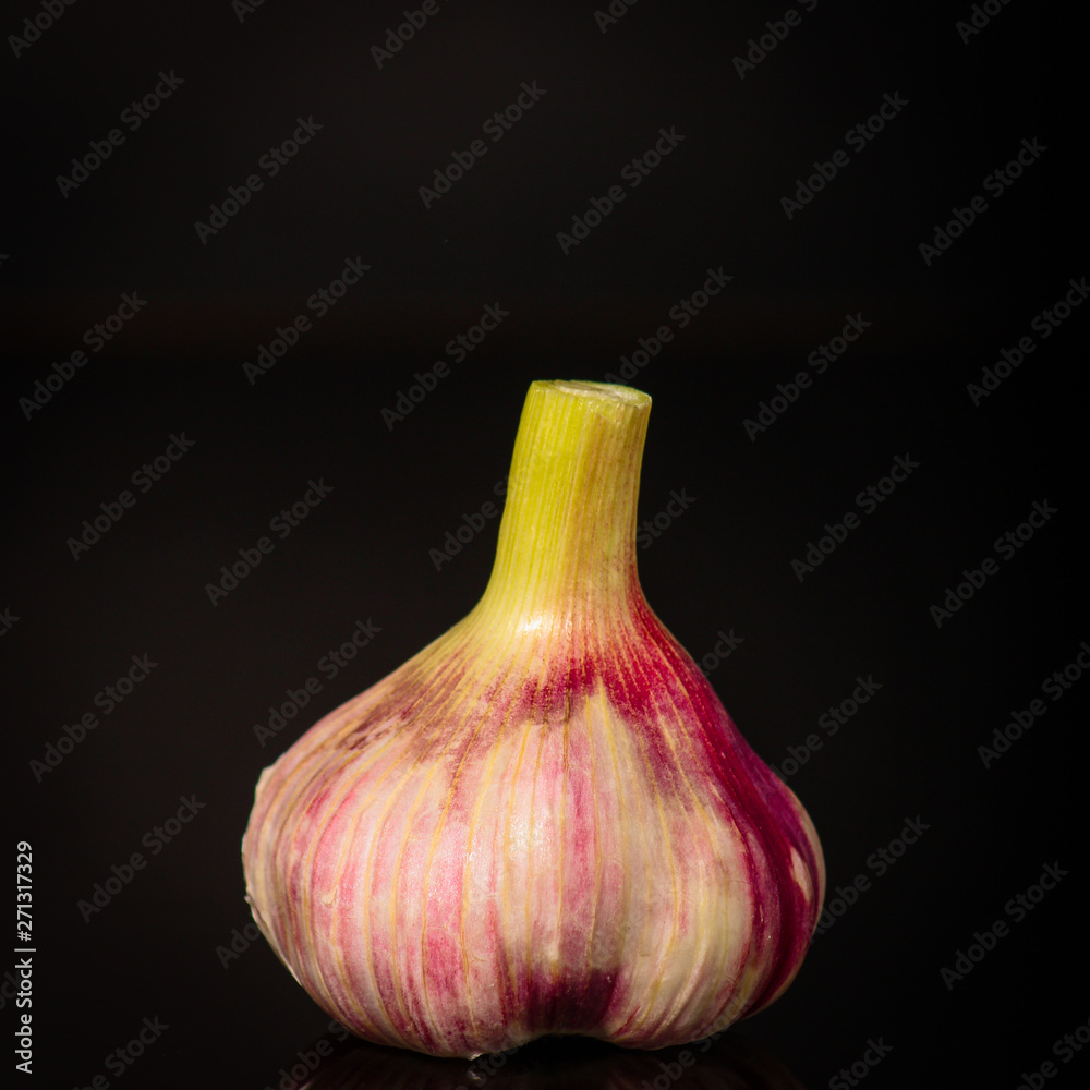 garlic (aromatic harvest) on a dark background. food. top