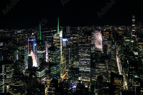 aerial night panorama of new york manhattan with glowing times square - top view
