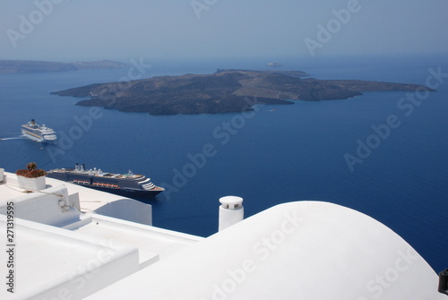 The volcano of Fira at Sunset as seen from the Santorini Island