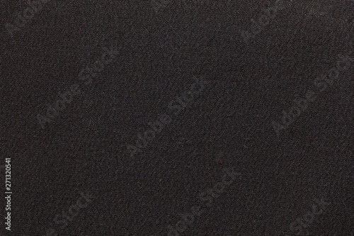 Dark gray fabric background texture. Detail of textile material close-up