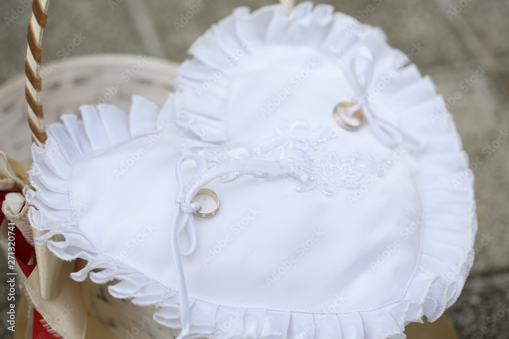 Golden wedding rings on cushion for rings Golden wedding rings on cushion for rings